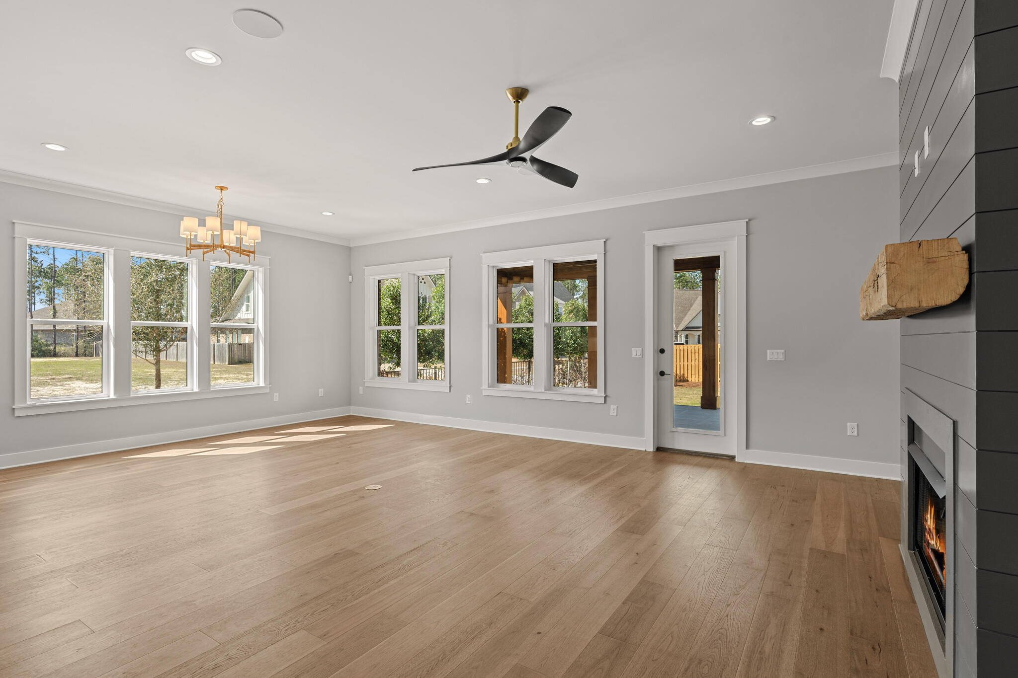 19 Caymus Cove Freeport, FL 32439 - Photo 10 of 41 a view of an empty room with a window and wooden floor