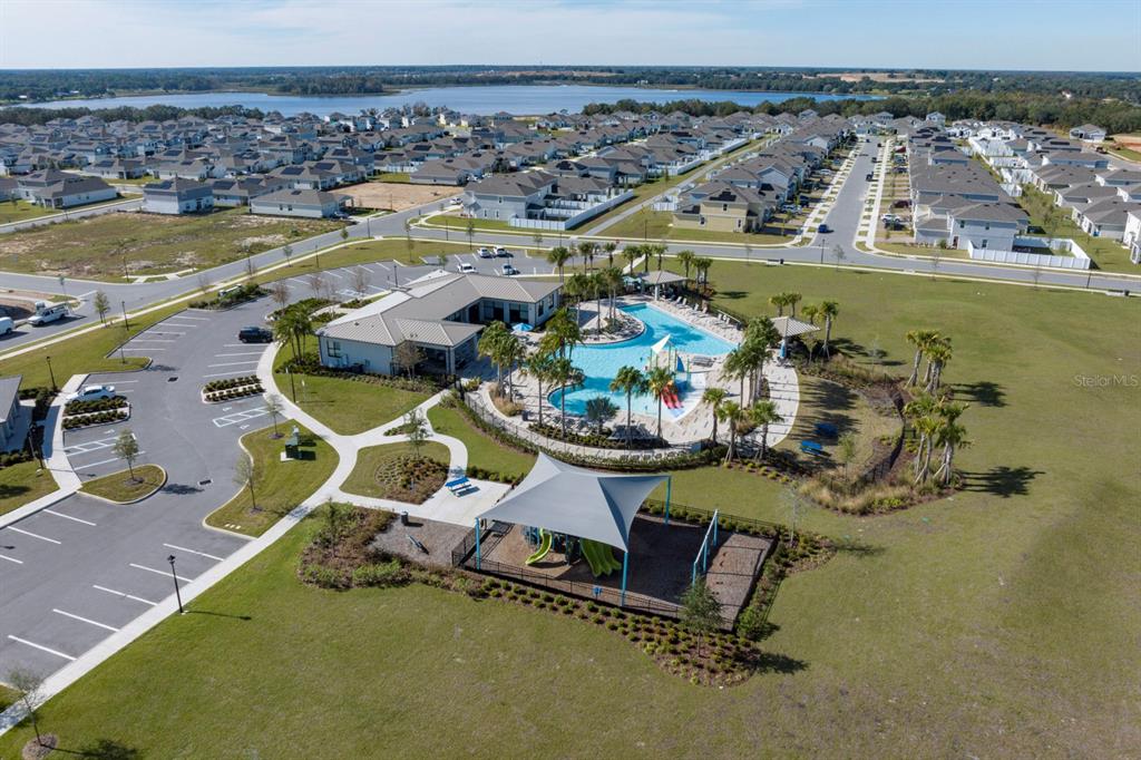 7056 Rolling Leaf Road Groveland, FL 34736 - Photo 4 of 8 an aerial view of a house with swimming pool and outdoor seating