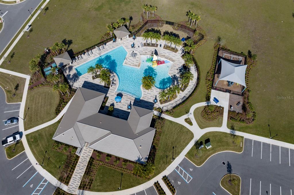 7056 Rolling Leaf Road Groveland, FL 34736 - Photo 5 of 8 an aerial view of a swimming pool