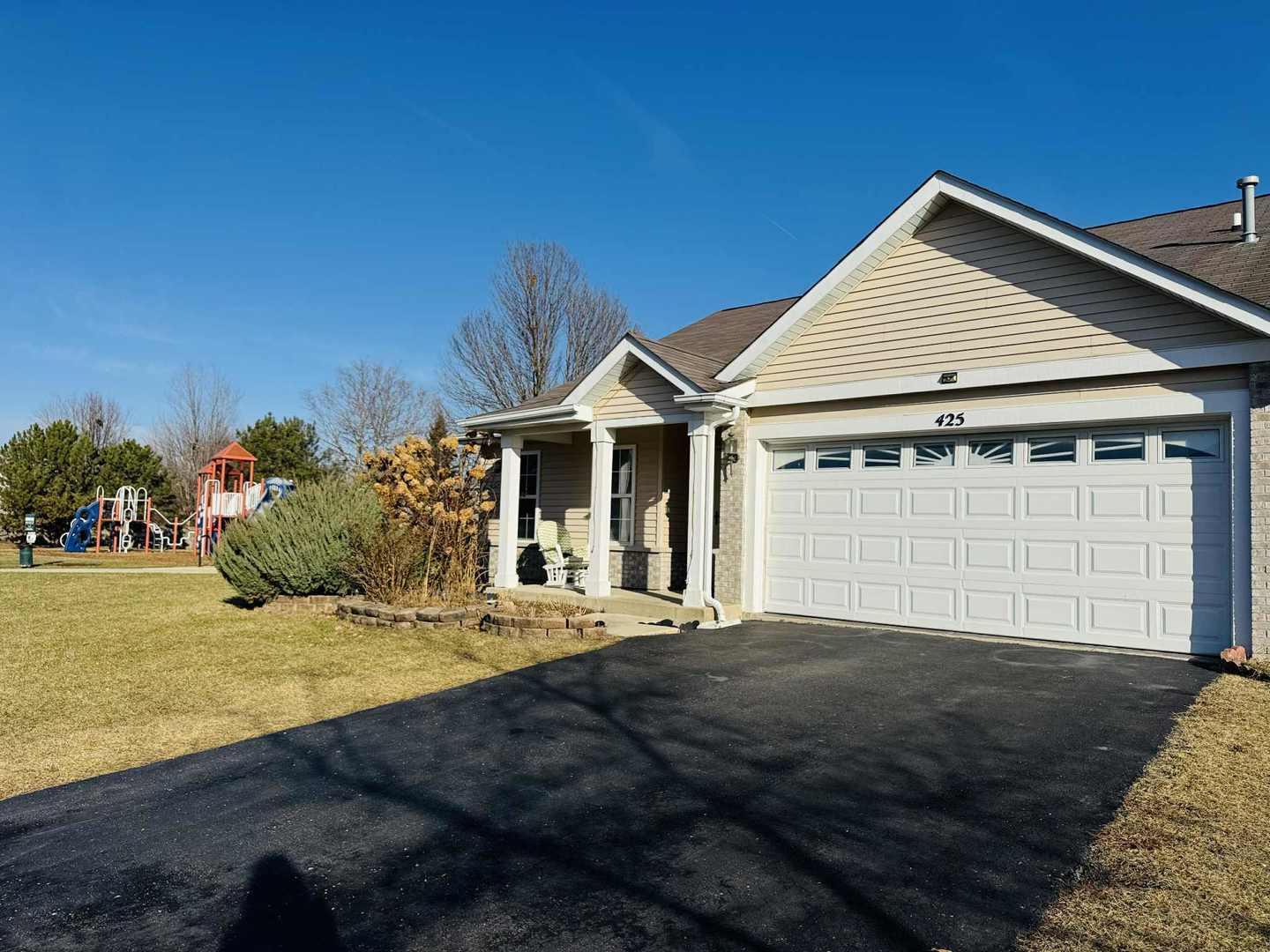 425 Claire Avenue Romeoville, IL 60446 - Photo 1 of 20 a front view of a house with a yard