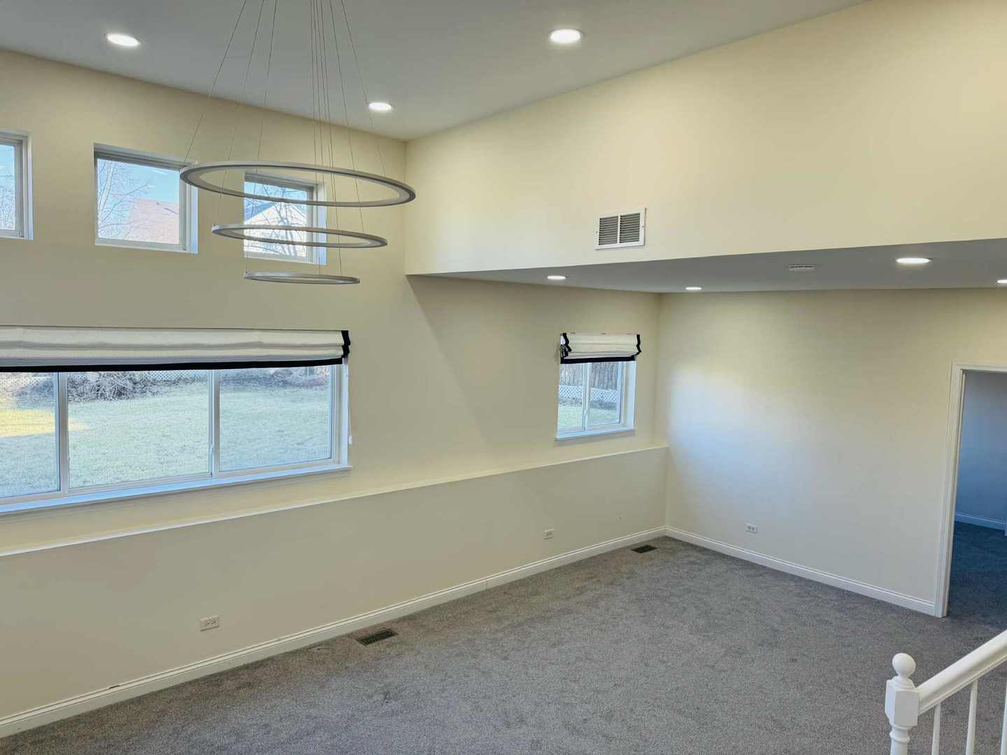 425 Claire Avenue Romeoville, IL 60446 - Photo 5 of 20 an empty room with a cabinet and mirrors