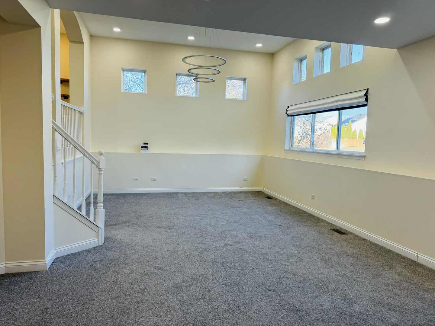 425 Claire Avenue Romeoville, IL 60446 - Photo 8 of 20 an empty room with windows