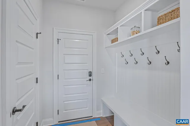 a view of an entryway with wooden floor