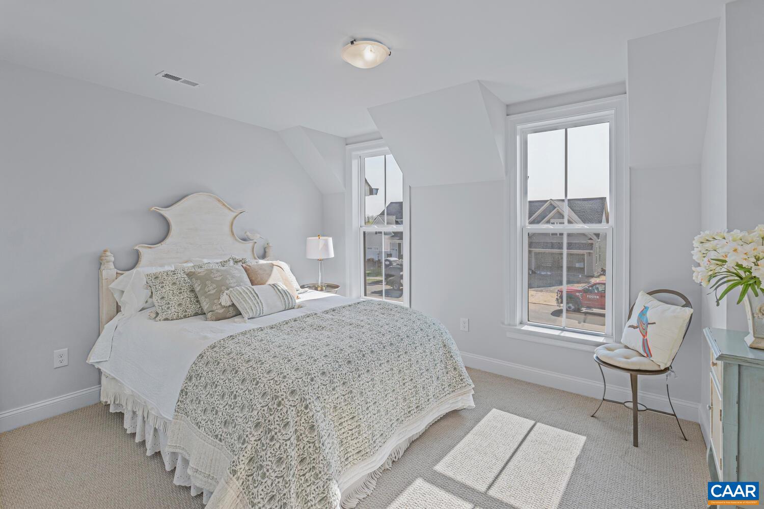 2 Agatha Ridge Lane, Unit LOT 2 Crozet, VA 22932 - Photo 20 of 42 a bedroom with a bed and a window