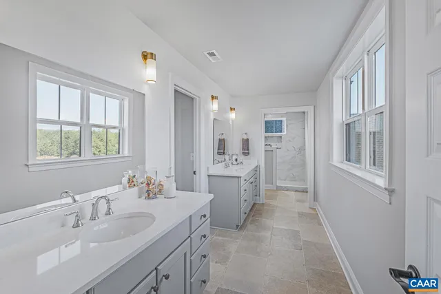 a bathroom with a double vanity sink mirror and double