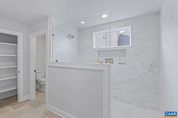 a view of storage and utility room with washer and dryer