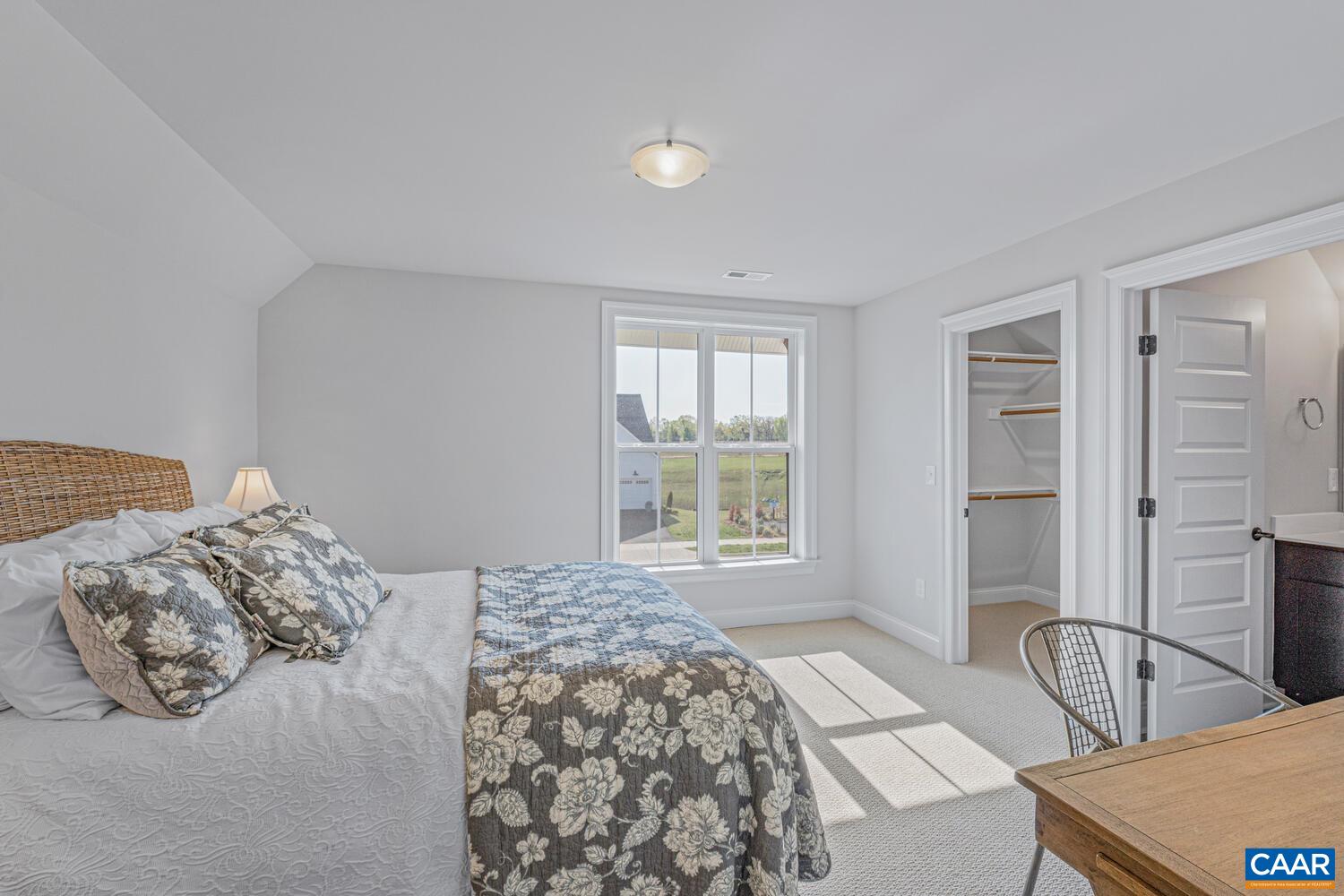 2 Agatha Ridge Lane, Unit LOT 2 Crozet, VA 22932 - Photo 30 of 42 a bedroom with a bed and a window