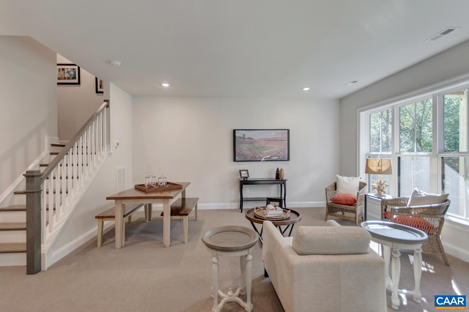 2 Agatha Ridge Lane, Unit LOT 2 Crozet, VA 22932 - Photo 35 of 42 a living room with furniture and a table