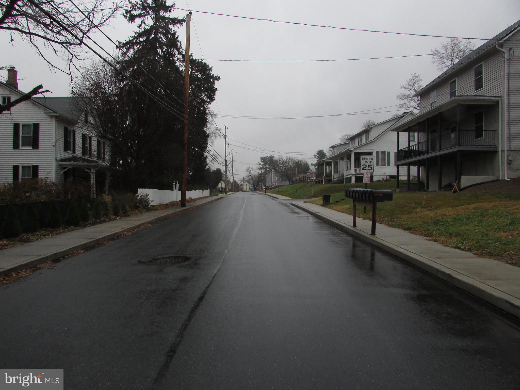 910 Main Street Delta, PA 17314 - Photo 15 of 20 a view of a street with houses on both side