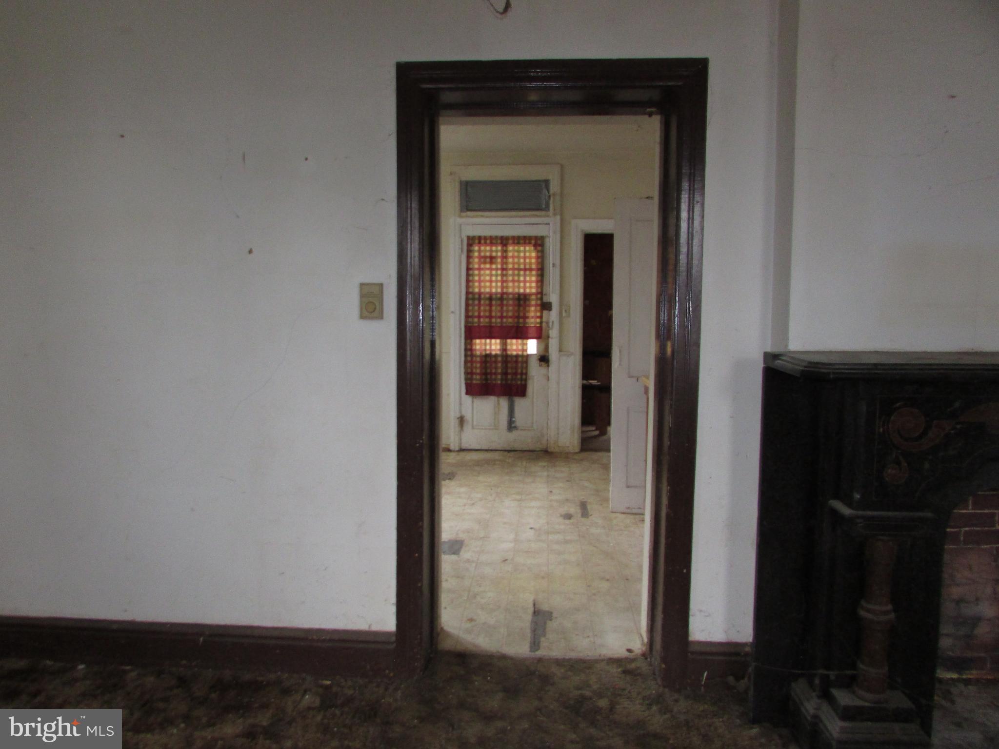 910 Main Street Delta, PA 17314 - Photo 3 of 20 a view of a hallway with wooden shelves
