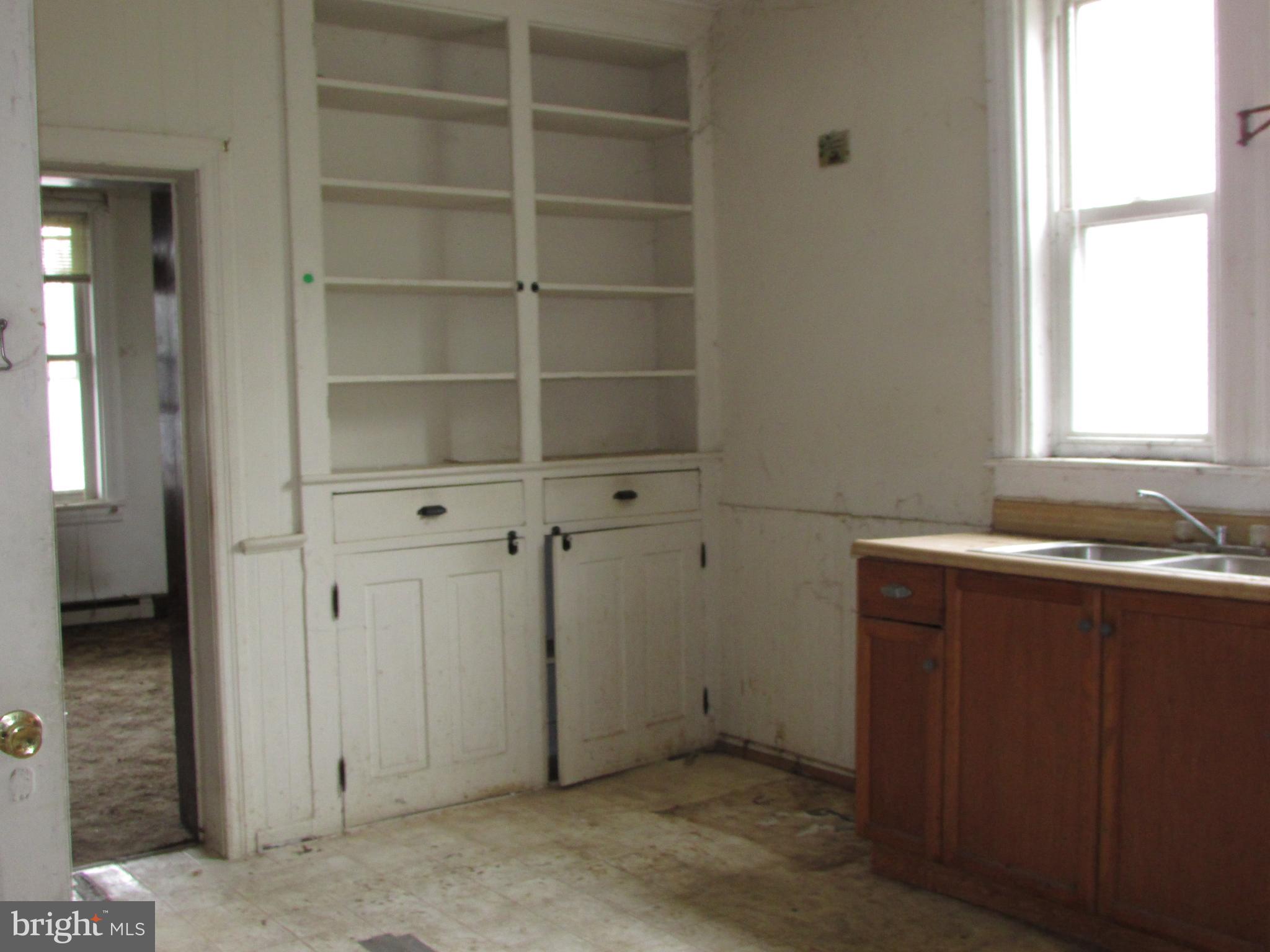 910 Main Street Delta, PA 17314 - Photo 4 of 20 a view of an empty room with a window