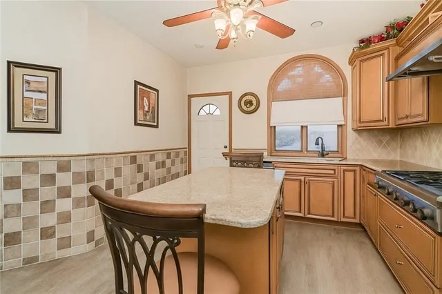 a kitchen with a table chairs and a stove