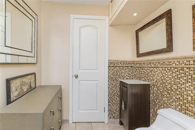 a bathroom with a sink a mirror and a shower