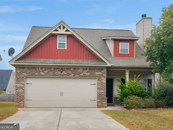 a front view of a house with garage