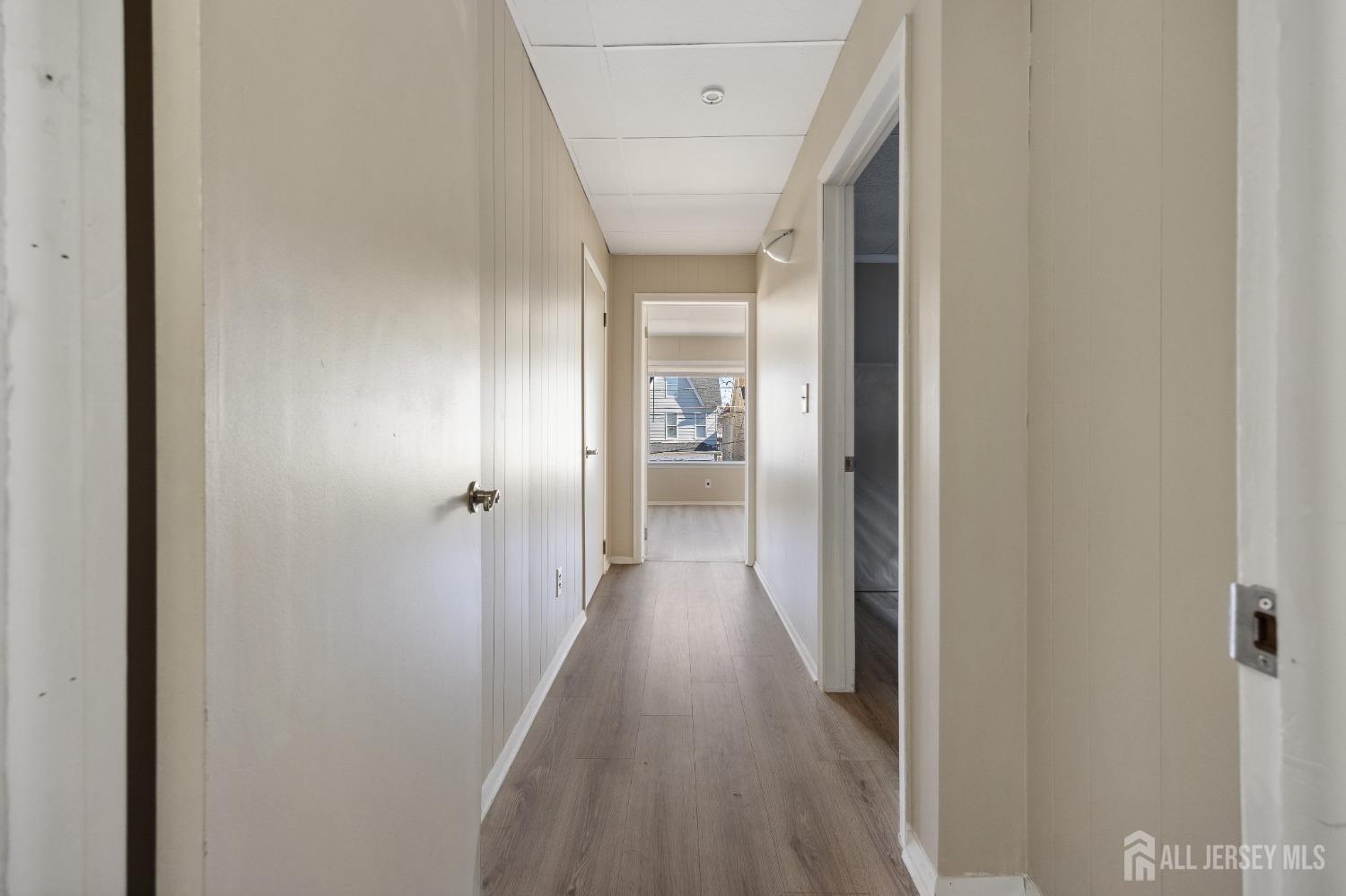 123 Madison Avenue Perth Amboy, NJ 08861 - Photo 16 of 30 a view of hallway with wooden floor
