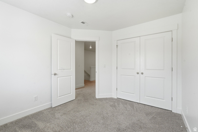 1173 West 1870 South Logan, UT 84321 - Photo 15 of 33 Room featuring light gray carpeting, white walls, and white trim