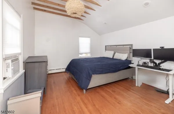 a bedroom with a large bed and a window