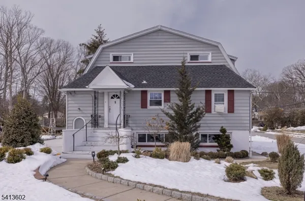 a front view of a house with a yard outdoor seating and yard