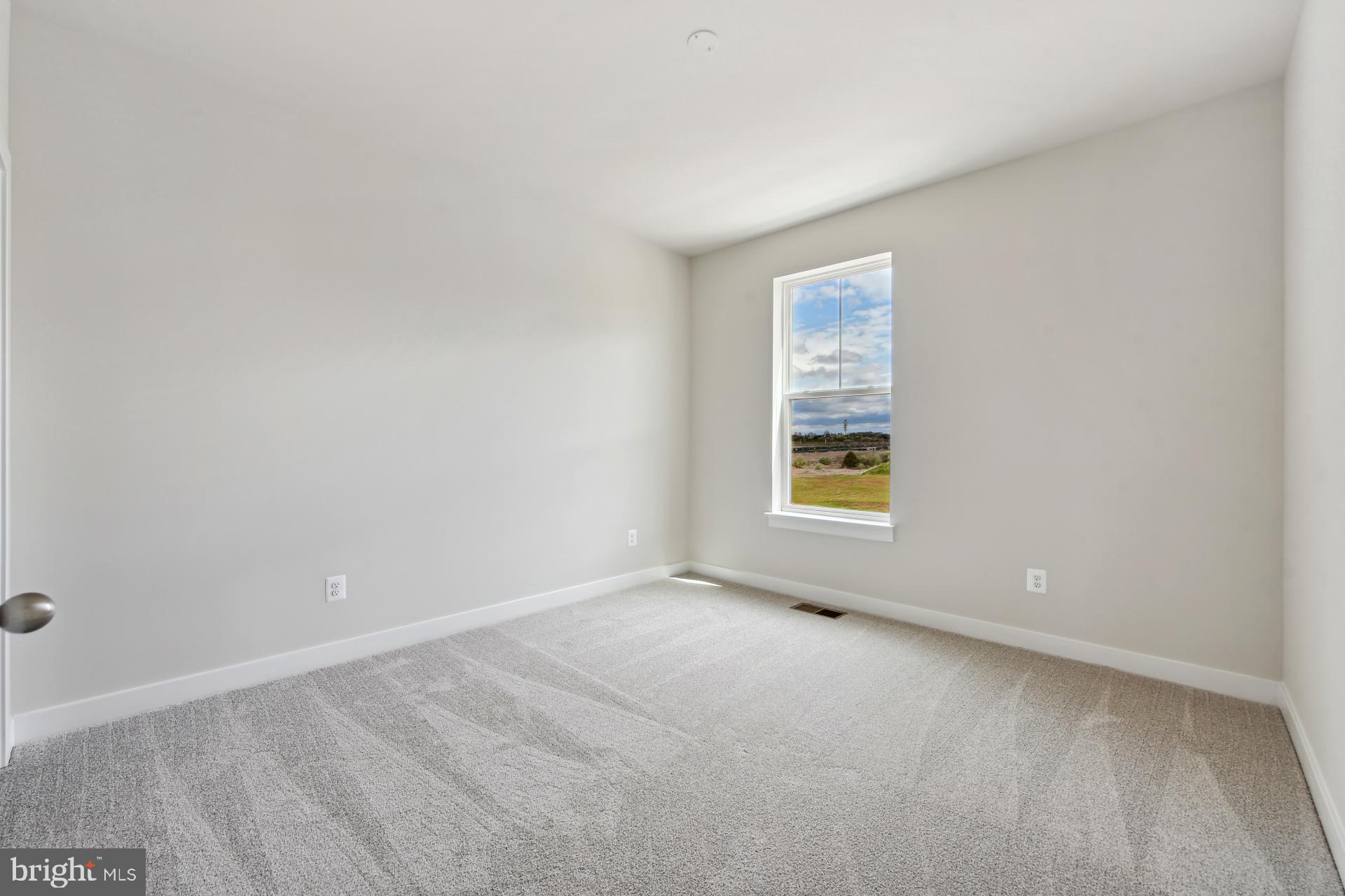 20783 Rumbullion Drive Sterling, VA 20166 - Photo 12 of 20 a view of an empty room with a window