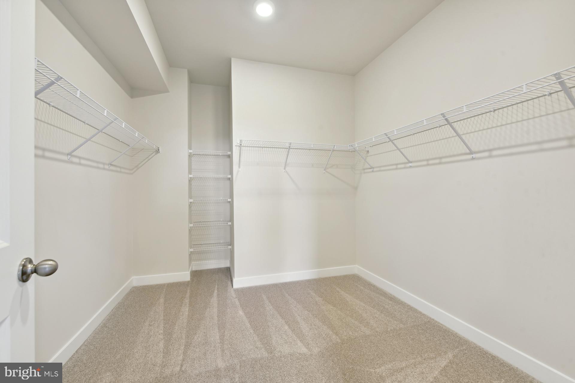 20783 Rumbullion Drive Sterling, VA 20166 - Photo 14 of 20 a view of a room with racks on the wall