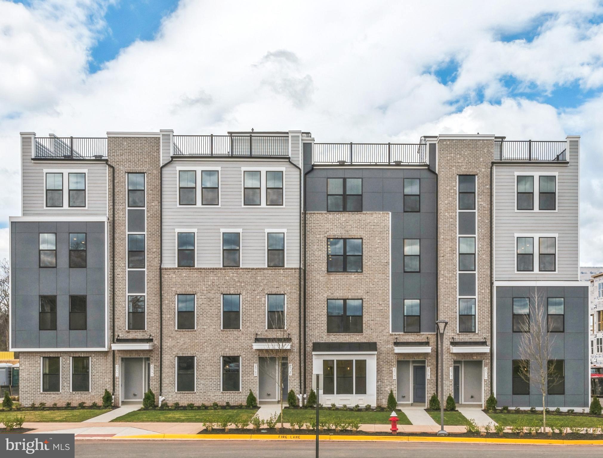 20783 Rumbullion Drive Sterling, VA 20166 - Photo 2 of 20 a front view of a multi story building