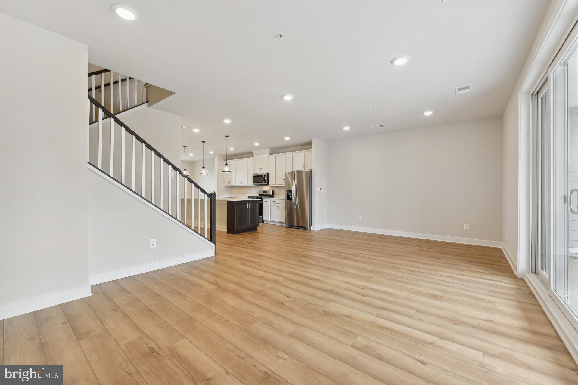 20783 Rumbullion Drive Sterling, VA 20166 - Photo 5 of 20 a view of entryway and hall with wooden floor