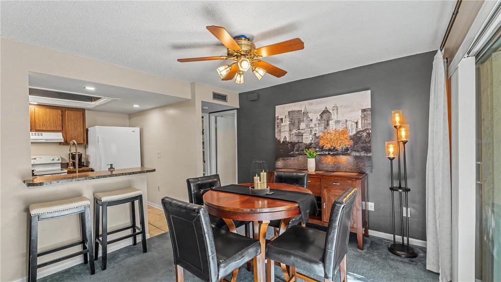 2025 Sylvester Road, Unit N305 Lakeland, FL 33803 - Photo 14 of 34 a dining room with furniture and window