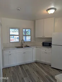 a kitchen with a cabinets and steel appliances