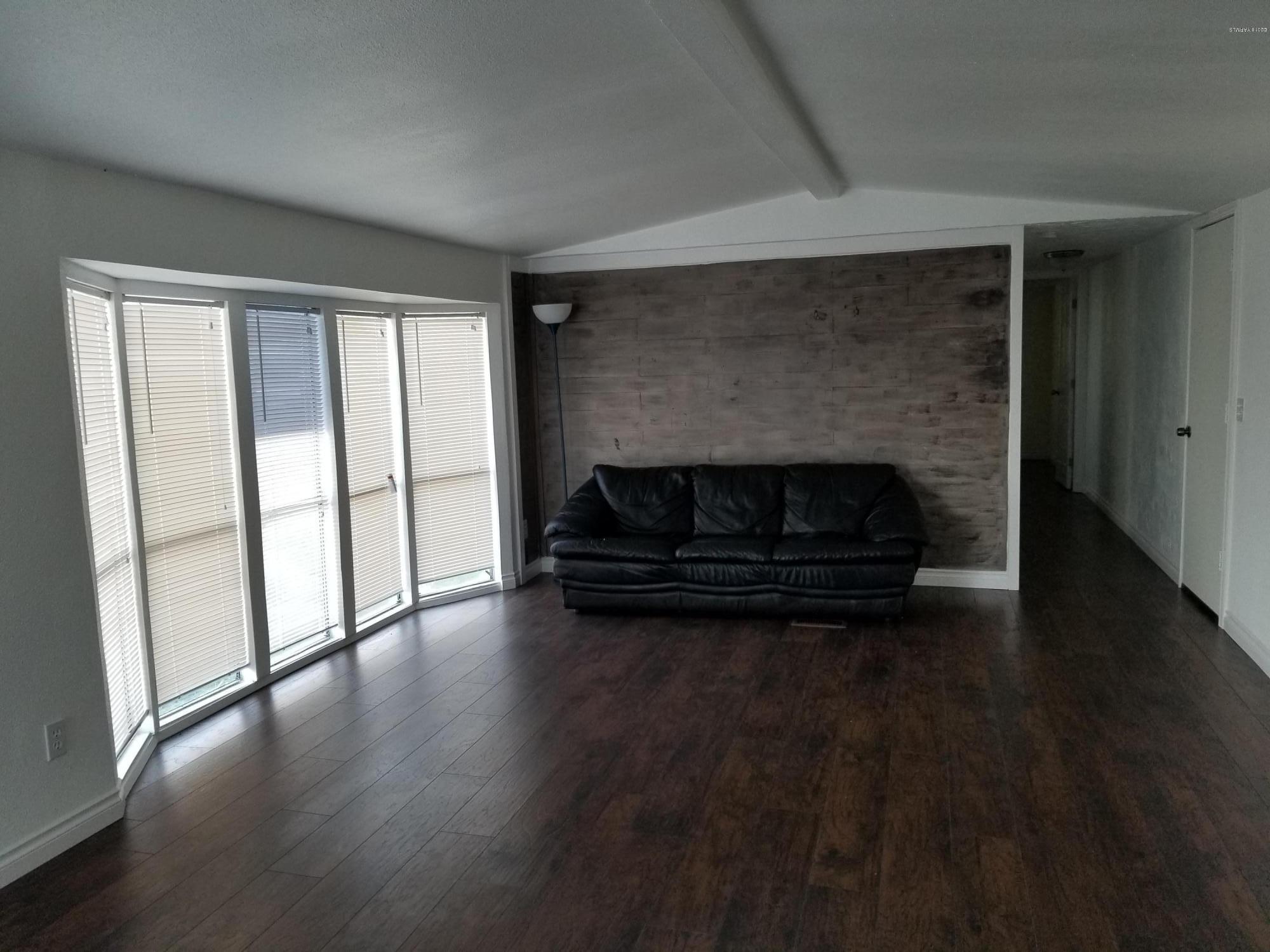 2802 Beaudry Road, Unit 58B Yakima, WA 98901 - Photo 2 of 11 a living room with a fireplace