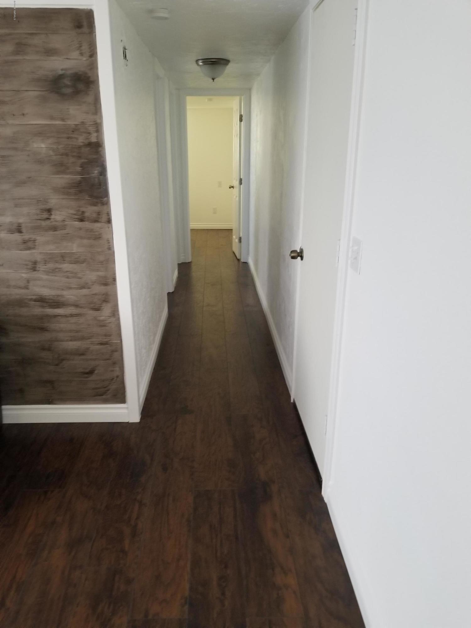 2802 Beaudry Road, Unit 58B Yakima, WA 98901 - Photo 4 of 11 a view of a hallway with wooden floor