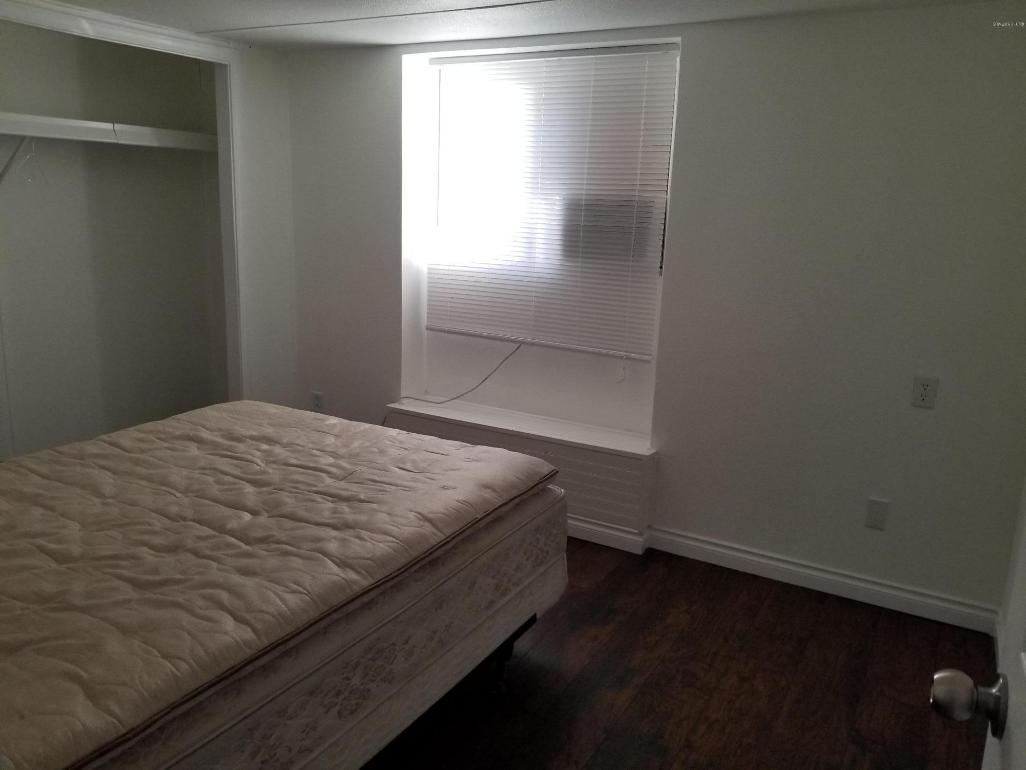 2802 Beaudry Road, Unit 58B Yakima, WA 98901 - Photo 8 of 11 a bedroom with a bed and a window