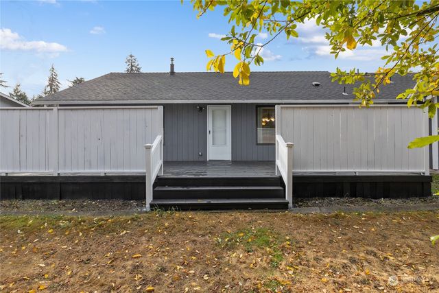 a view of small space with a white fence
