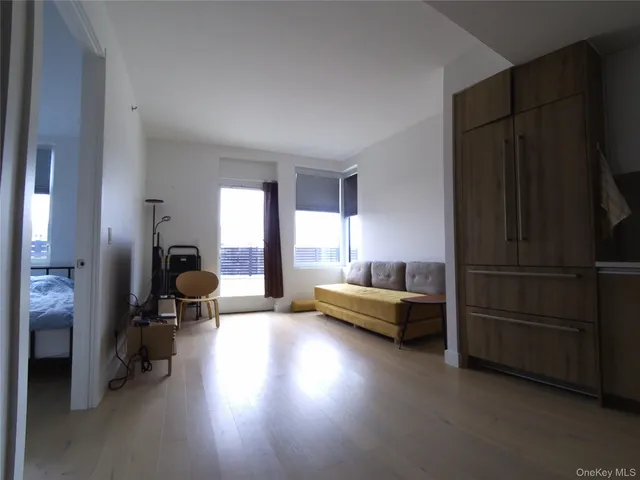 a living room with furniture windows and a table