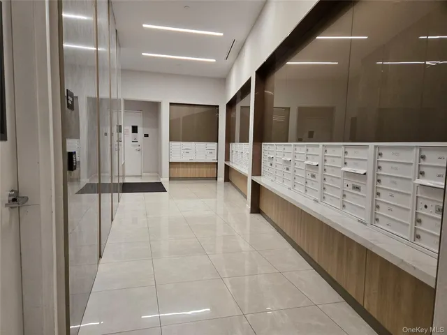 a bathroom with a tub shower vanity and sink