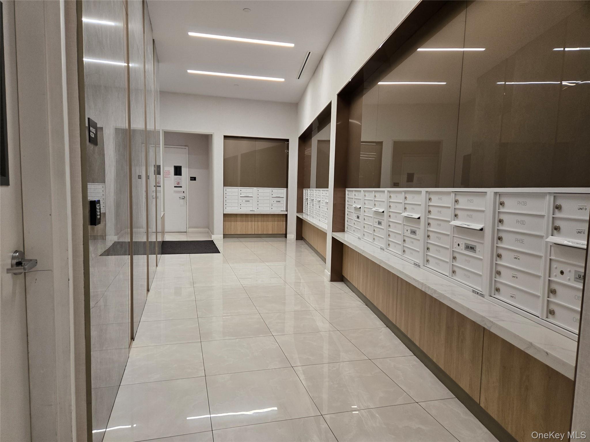 136-18 Maple Avenue, Unit 5E Queens, NY 11355 - Photo 8 of 11 a bathroom with a tub shower vanity and sink