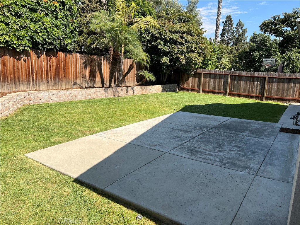 1711 Heather Avenue Tustin, CA 92780 - Photo 7 of 13 a view of a backyard with large trees