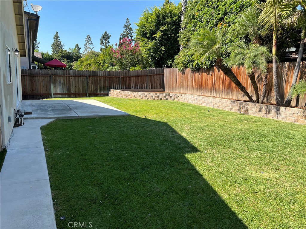 1711 Heather Avenue Tustin, CA 92780 - Photo 8 of 13 a swimming pool with wooden fence