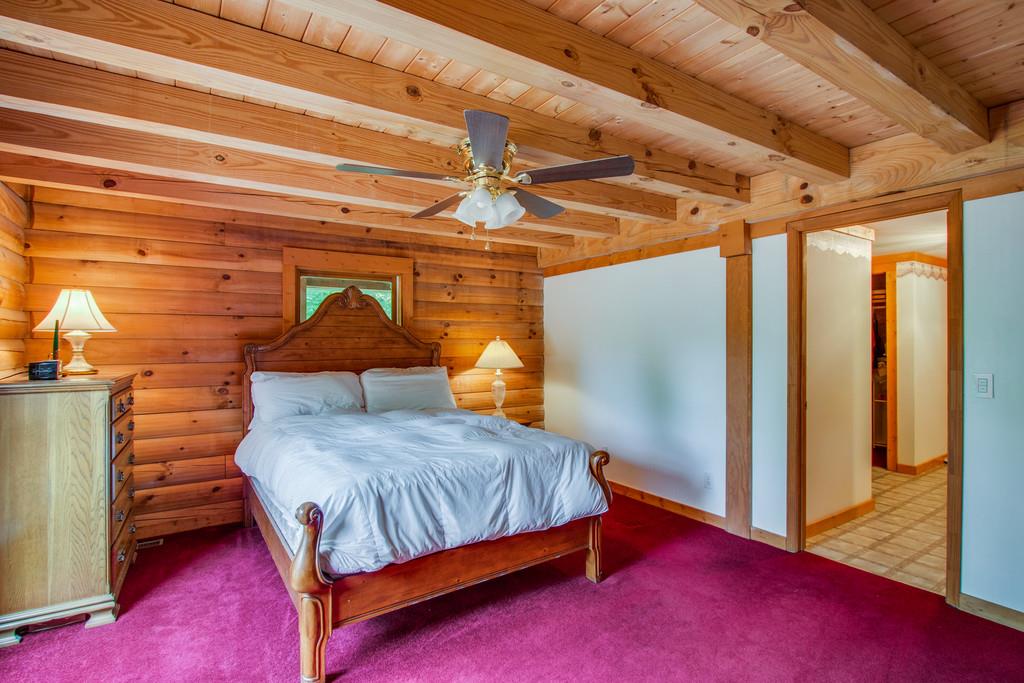 744 Keytown Road Portland, TN 37148 - Photo 13 of 30 a bedroom with a bed and wooden floor