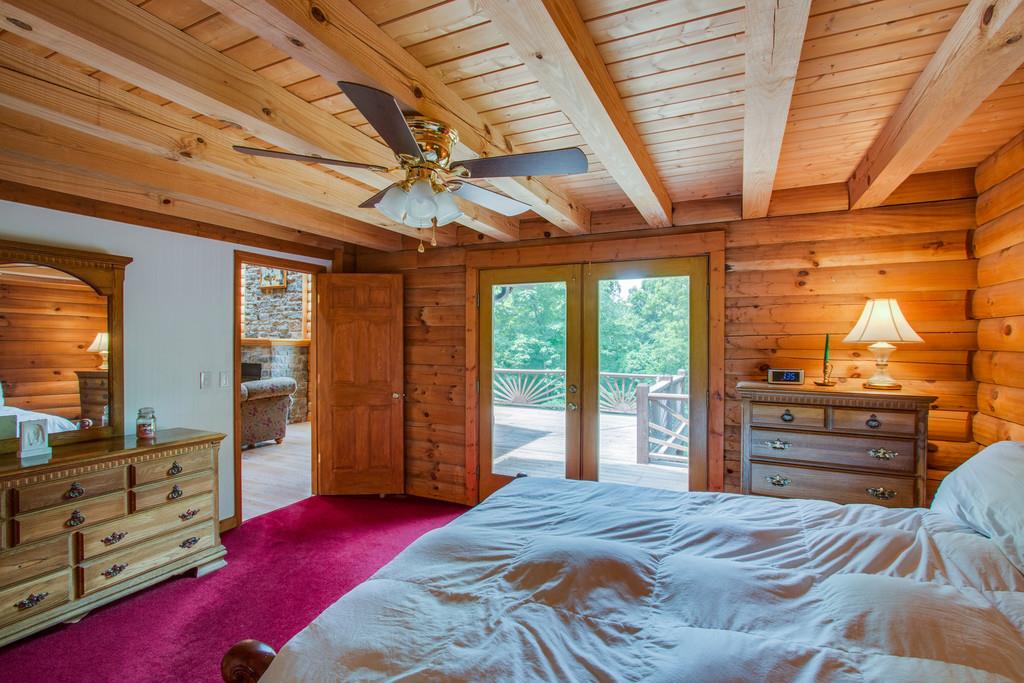 744 Keytown Road Portland, TN 37148 - Photo 14 of 30 a bedroom with a large bed and a dresser