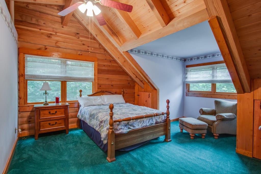 744 Keytown Road Portland, TN 37148 - Photo 21 of 30 a bed room with a bed and a chair