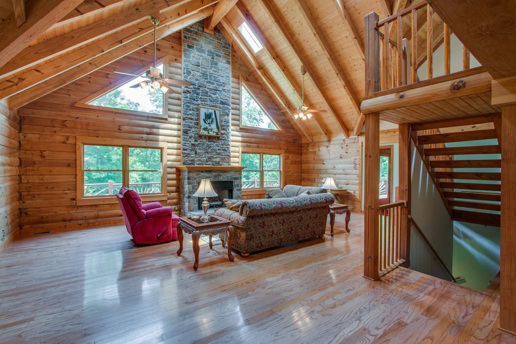 744 Keytown Road Portland, TN 37148 - Photo 5 of 30 a living room with furniture a fireplace and wooden floor