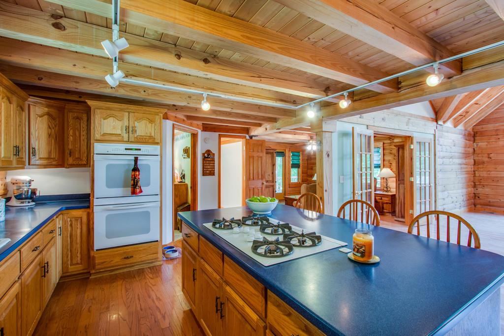 744 Keytown Road Portland, TN 37148 - Photo 9 of 30 a kitchen with stainless steel appliances granite countertop a stove and refrigerator