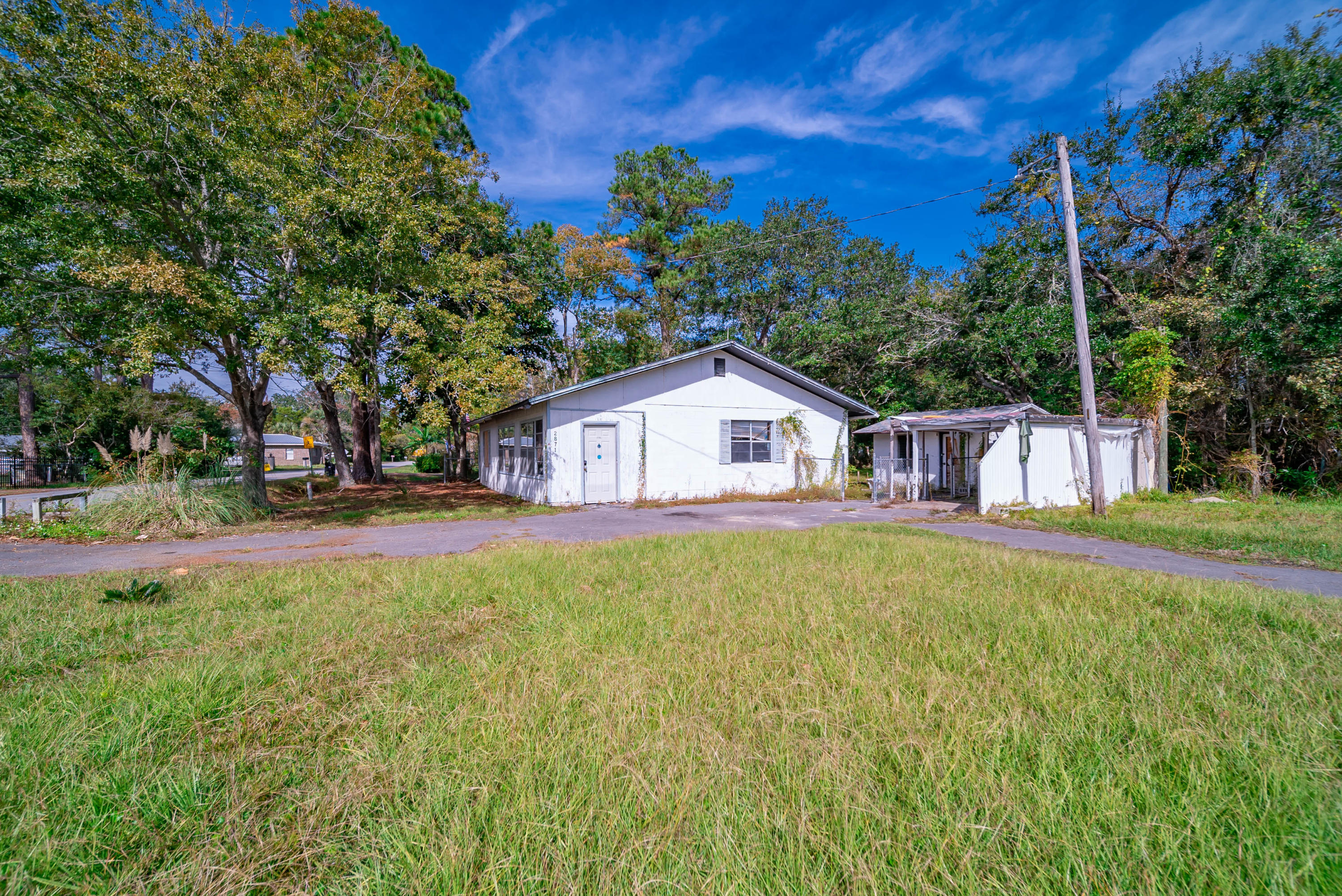 2871 Bay Grove Road Freeport, FL 32439 - Photo 14 of 17 a front view of a house with yard and green space