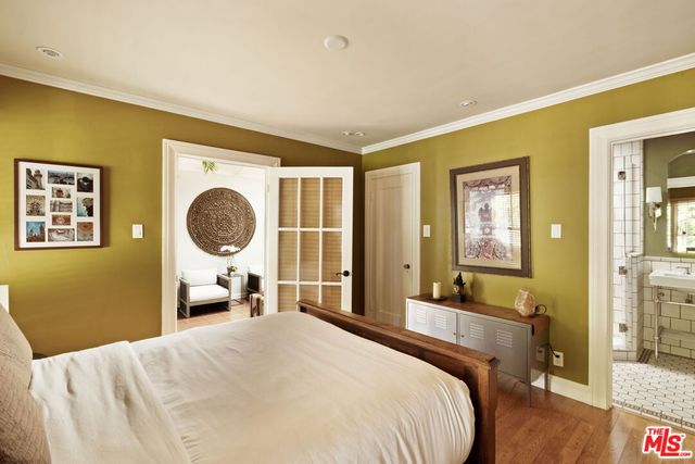 a bedroom with a bed and a cabinets