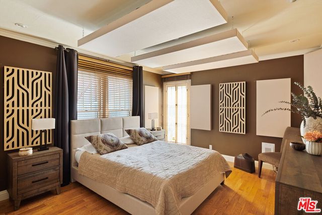 a bedroom with a bed and a couch