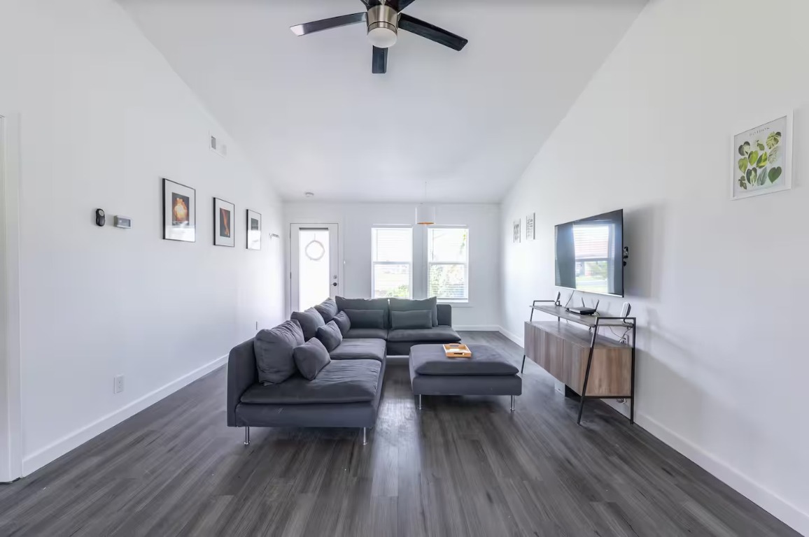 9715 Dallum Drive Austin, TX 78753 - Photo 12 of 21 a living room with furniture and a wooden floor