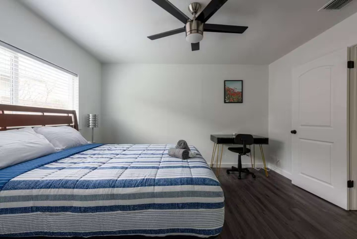 9715 Dallum Drive Austin, TX 78753 - Photo 15 of 21 a bedroom with a bed and a window