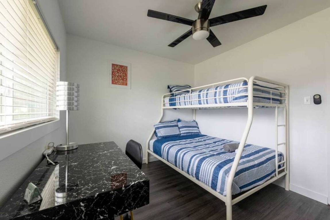 9715 Dallum Drive Austin, TX 78753 - Photo 19 of 21 a bedroom with a bed and a window