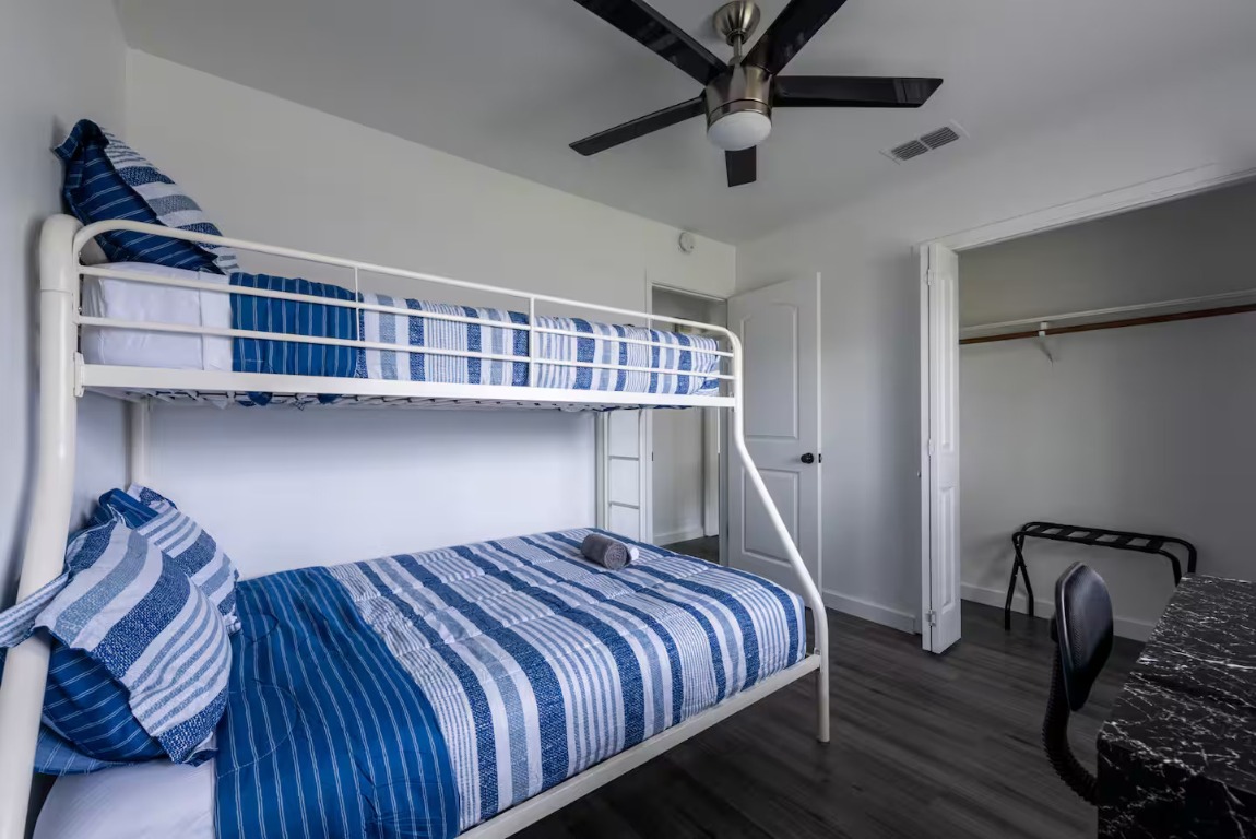 9715 Dallum Drive Austin, TX 78753 - Photo 21 of 21 a bedroom with bed and wooden floor