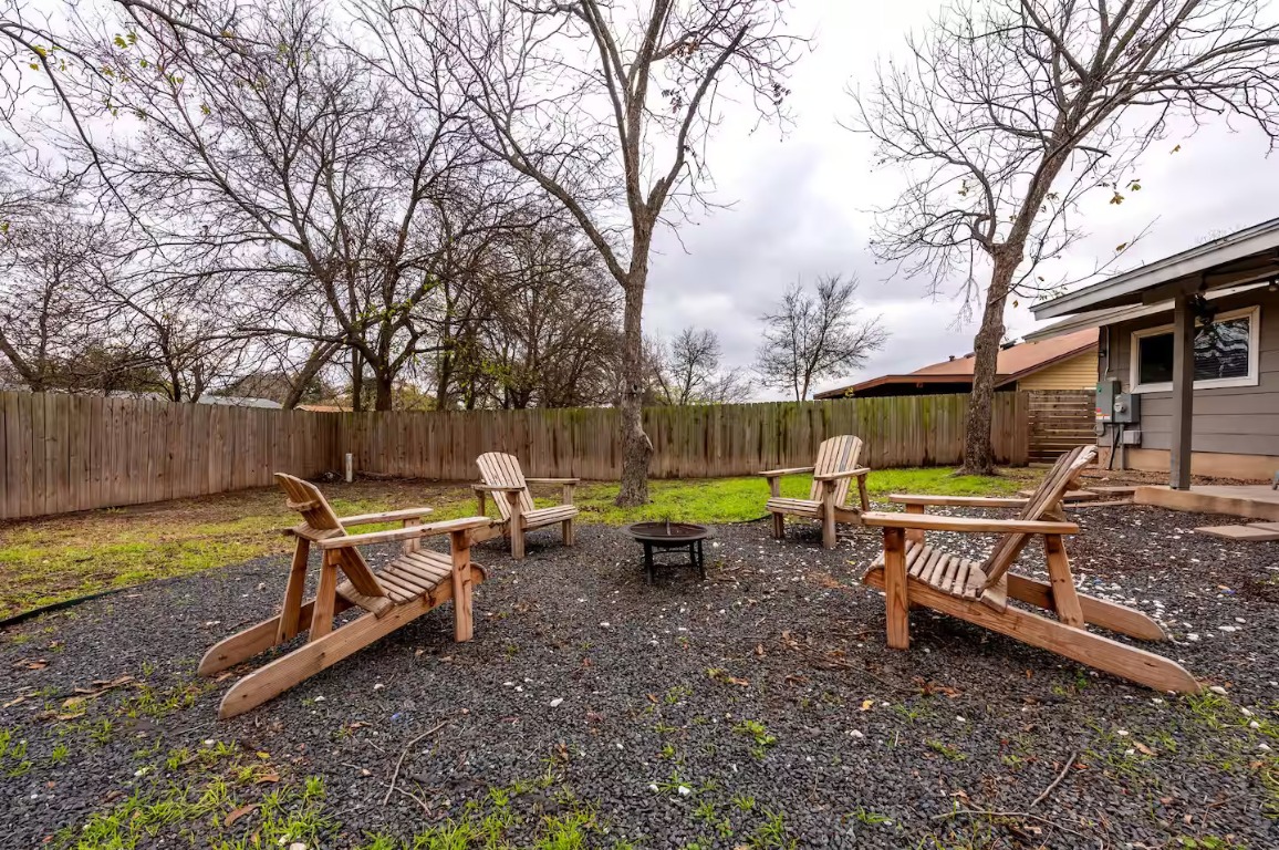 9715 Dallum Drive Austin, TX 78753 - Photo 5 of 21 a backyard of a house with table and chairs